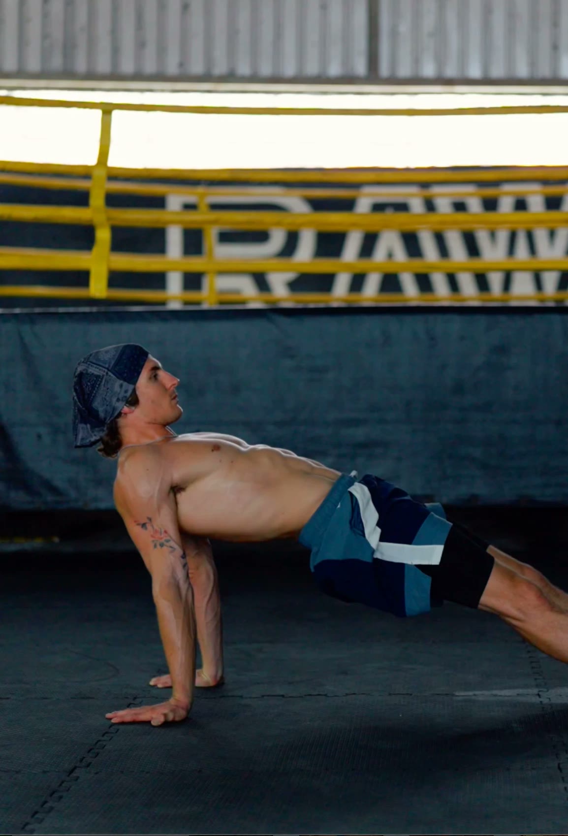 Genno holding a reverse plank